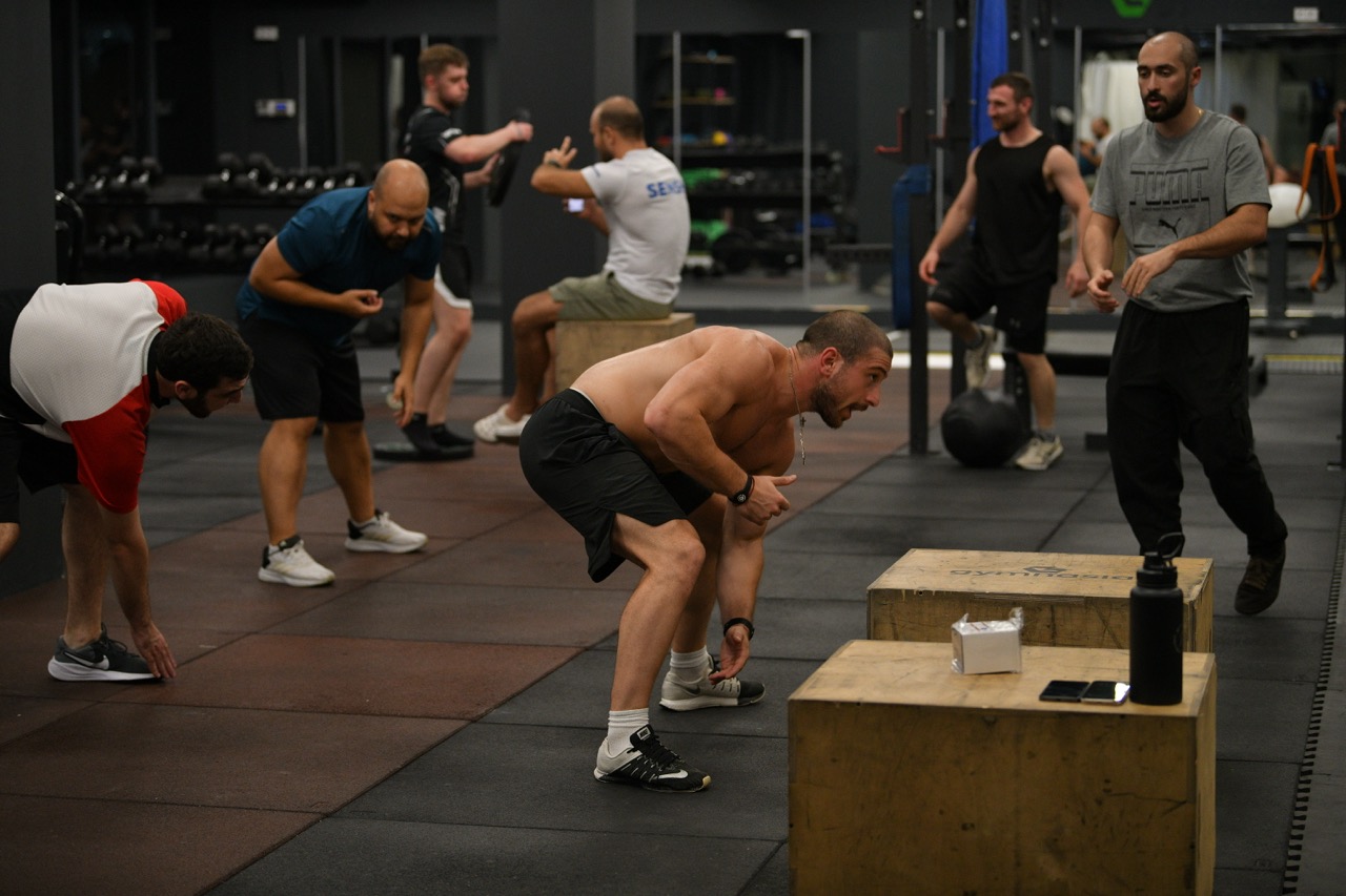 Camp athlete completing conditioning work in the Gymnasia fitness area